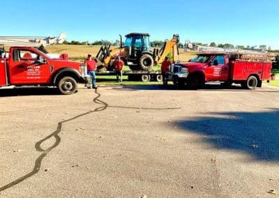 men with Water Well Trucks